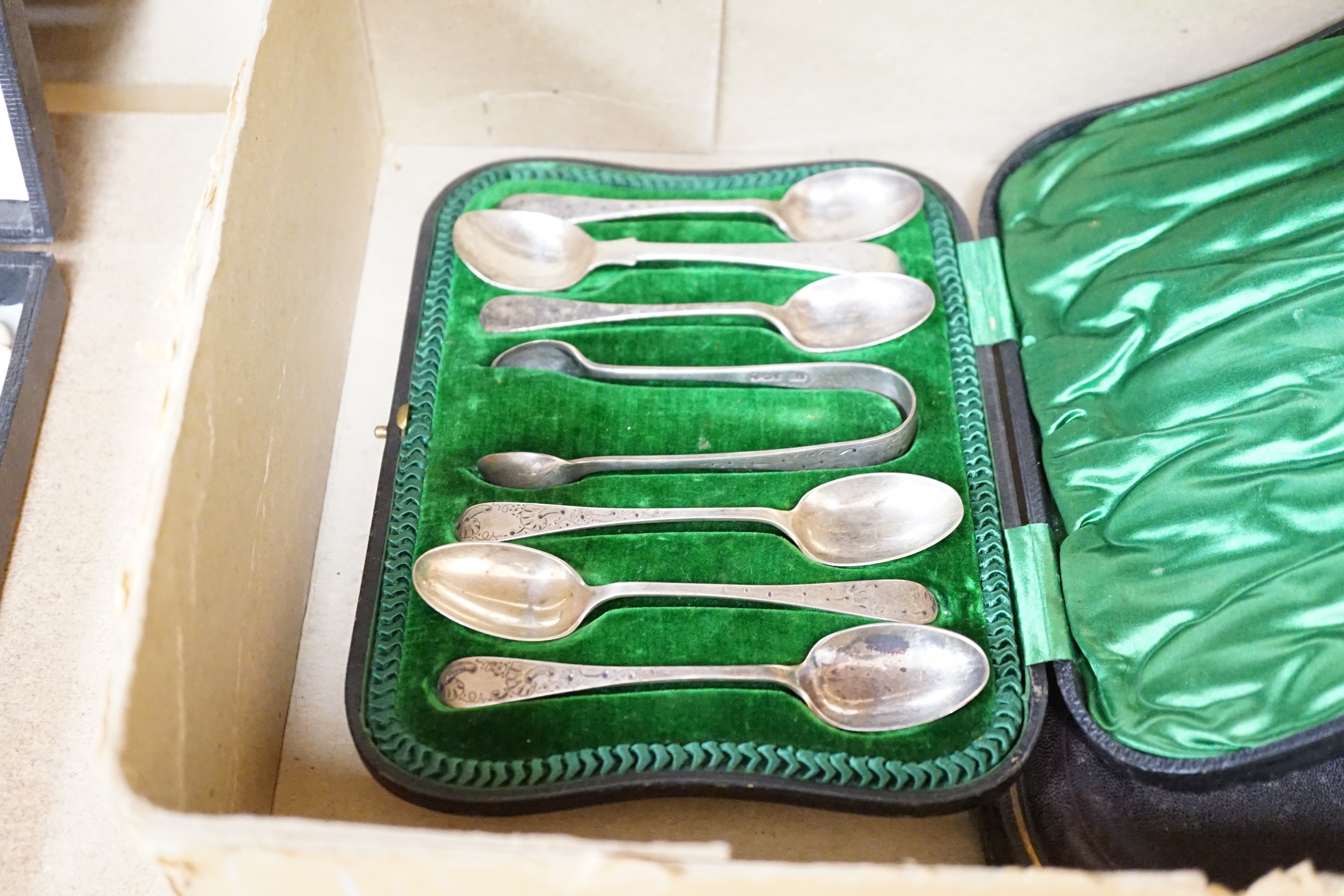 A group of assorted cased flatware comprising a set of six silver coffee spoons, Birmingham 1949, 100 grams, a silver fork and plated spoon christening set, fork 49 grams, a set of five Edwardian silver teaspoons and ton
